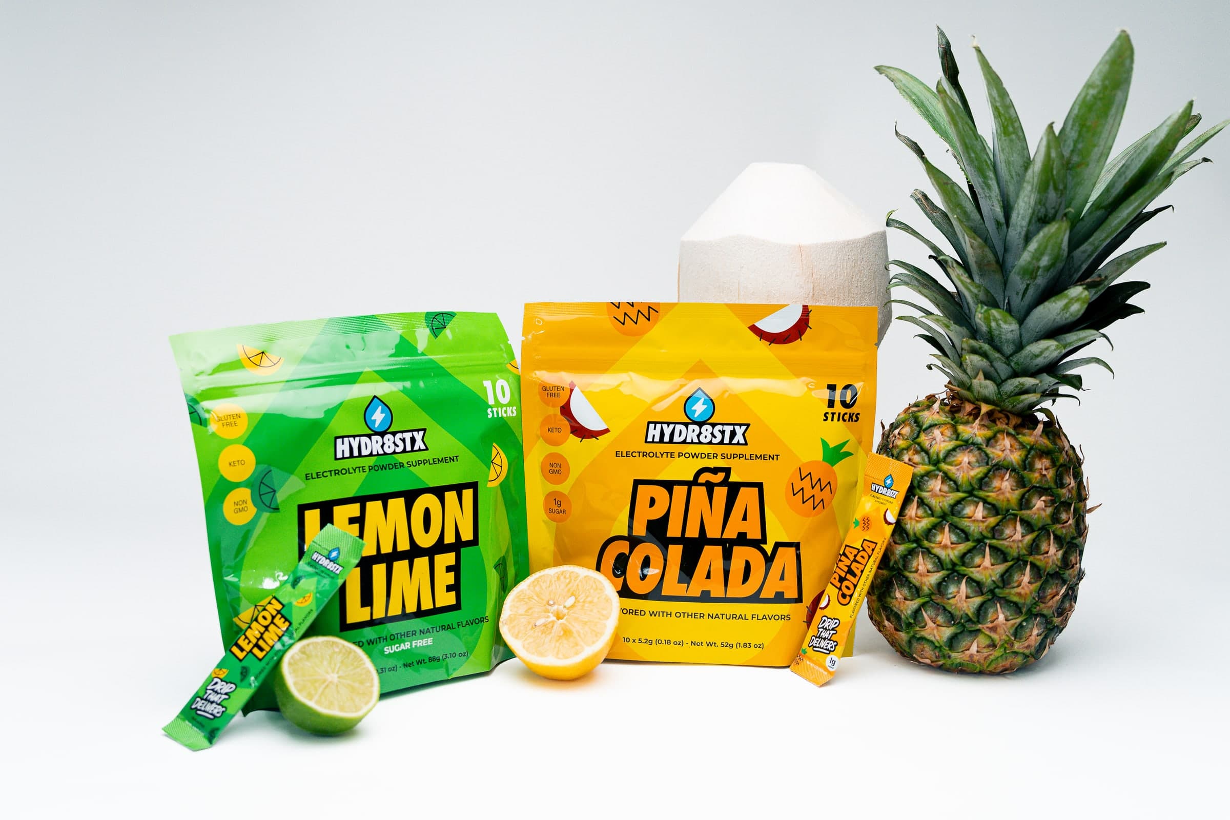 Hydr8Stx Lemon Lime and Piña Colada pouches with fresh fruit