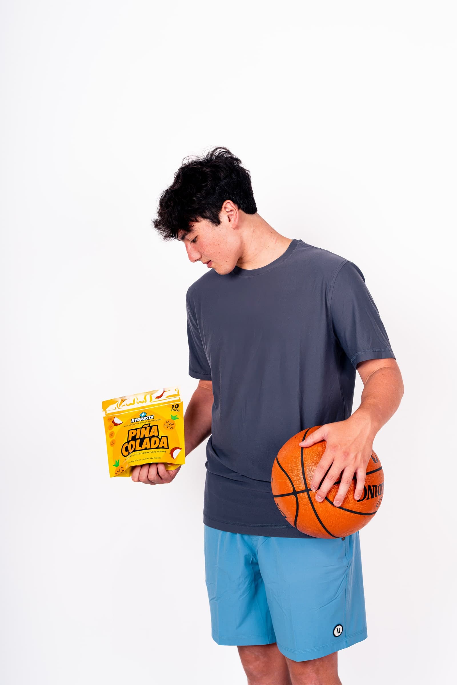 Hydr8Stx co-founder Dominic holding a basketball